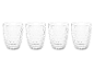 Neli läbipaistvat klaasi geomeetrilise mustriga, mustal taustal.