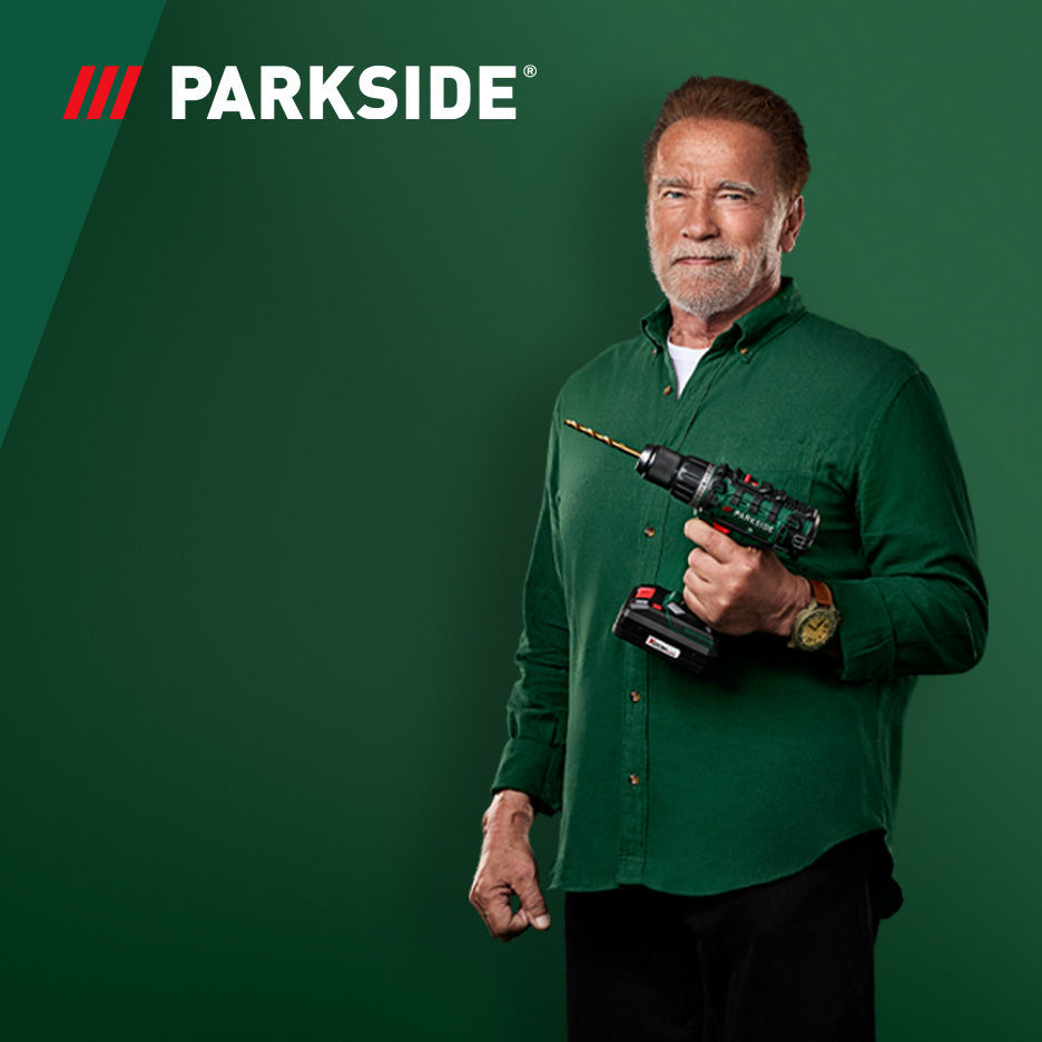 Arnold Schwarzenegger hoiab Parkside'i akutrelli rohelisel taustal.