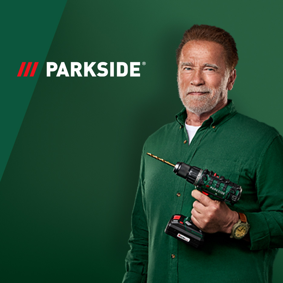 Arnold Schwarzenegger hoiab Parkside'i akutrelli rohelisel taustal.