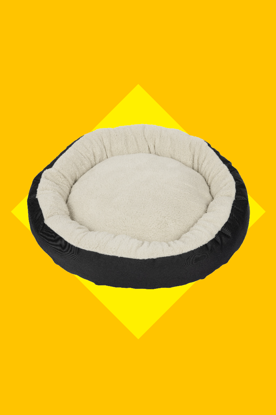 Must ja kreemikas ümmargune lemmikloomavoodi, millel on pehme sisu.