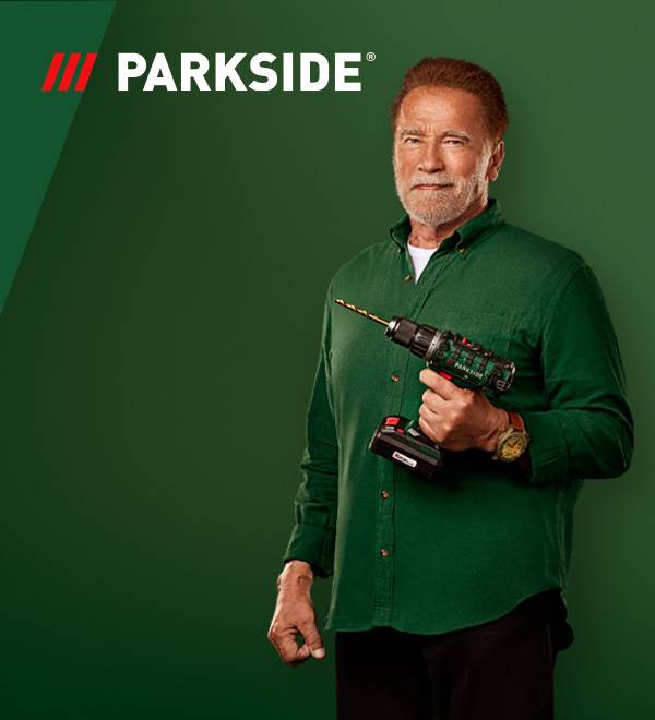 Arnold Schwarzenegger hoiab Parkside'i akutrelli rohelisel taustal.